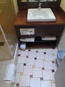 a bathroom with a sink and a counter with towels at Front beach studio of ilet Gosier in Le Gosier