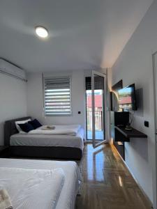 Ένα ή περισσότερα κρεβάτια σε δωμάτιο στο Apartman Novak Sokobanja