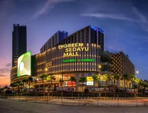a large building with a sign that reads oxygenessenessen mall at TJ Brother Residences Cengkareng in Jakarta