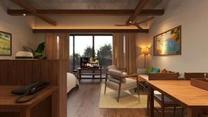 uma sala de estar com uma secretária e uma sala de estar com um sofá em Nexus House Signature Xuân Thuỷ em Cidade de Ho Chi Minh mais 14 fotografias