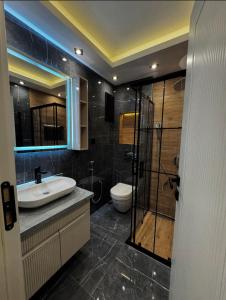 Koupelna v ubytování Level Deluxe Hotel