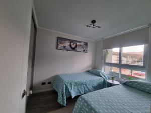 Postel nebo postele na pokoji v ubytování Agradable departamento en Papudo + 19 fotografií