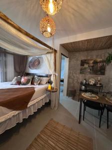 Una cama o camas en una habitación de Hospedaria Ana Julia