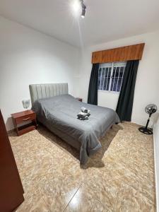 Postel nebo postele na pokoji v ubytování Complejo NAEN - Apartamentos a 1 Cuadra del Mar - Mar del Tuyú