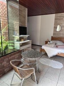 Una televisión o centro de entretenimiento en Hospedaria Ana Julia