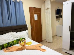 Ένα ή περισσότερα κρεβάτια σε δωμάτιο στο Pousada Caribe de Alter