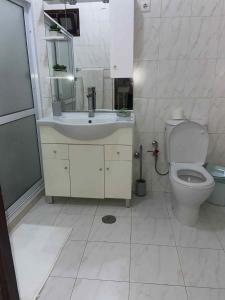 a bathroom with a sink and a toilet at MONTROND House in São Filipe +5 photos