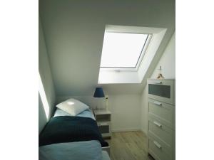 Una cama o camas en una habitación de Moderne Ferienwohnung mit Sauna & Terrasse