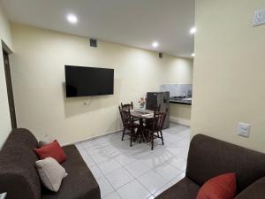 a living room with a couch and a table at Herrera departamentos in Tepic