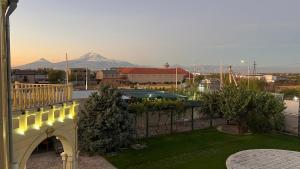a bridge over a yard with a mountain in the background at Otyak Plaza in Pʼarakʼar