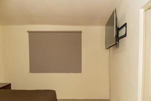 TV a/nebo společenská místnost v ubytování Comfortable alojamiento Luna María - group of friends