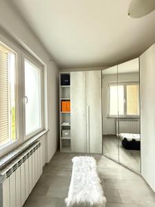 a living room with a large sliding glass door at Verdellino Bijoux Residence in Verdellino