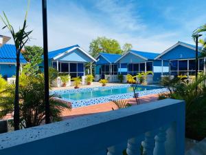 a villa with a swimming pool in a resort at Orchid bokor family guest house in Kampot