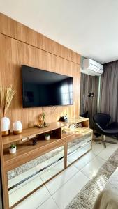 TV a/nebo společenská místnost v ubytování Charmoso Flat em Itaipava, 509 Mangabeiras. + 42 fotografií