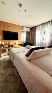 Postel nebo postele na pokoji v ubytování Charmoso Flat em Itaipava, 509 Mangabeiras.