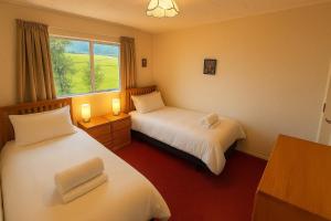 Postel nebo postele na pokoji v ubytování Seaview Escape in Patons Rock