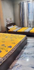 Postel nebo postele na pokoji v ubytování SAABY HoMESTAY