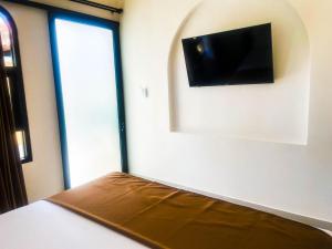 TV a/nebo společenská místnost v ubytování Sundari Guesthouse Pererenan + 21 fotografií