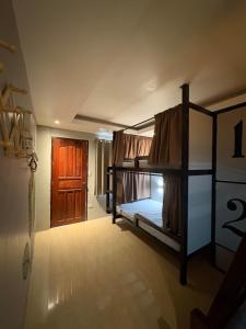 Ένα ή περισσότερα κρεβάτια σε δωμάτιο στο Coluradel Hostel