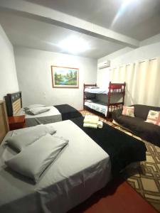 Ένα ή περισσότερα κρεβάτια σε δωμάτιο στο Pousada CASA BELLA VISTA 945 +17 φωτογραφίες