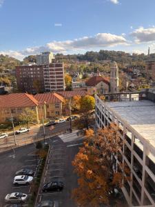 arial view of a city with cars parked in a parking lot at Opulent Oasis Located in The Heart of Birmingham in Birmingham