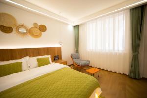 En eller flere senge i et værelse på Feihua Qingmeng Homestay