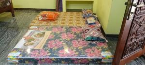 Ένα ή περισσότερα κρεβάτια σε δωμάτιο στο Depajothi malai rooms