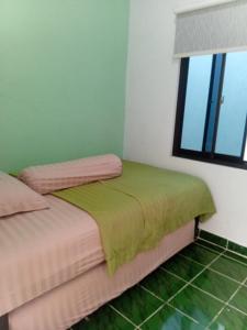 Una cama o camas en una habitación de House of Heritage-Kraton