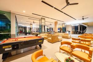 a billiard room with a pool table and chairs at Casa Del M Patong Phuket - Newly Renovated in Patong Beach