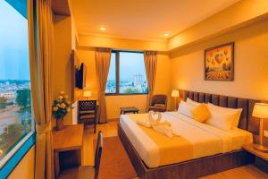 Postel nebo postele na pokoji v ubytování De Glance Udaipur