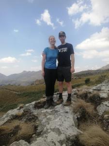 a man and a woman standing on a rock at Hike mount mulanje with Harry in Lilongwe