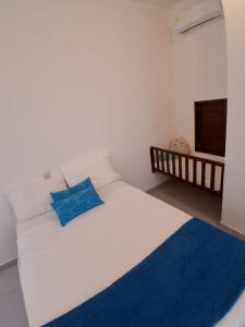 Ένα ή περισσότερα κρεβάτια σε δωμάτιο στο Pajaro Brujo