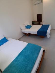 Ένα ή περισσότερα κρεβάτια σε δωμάτιο στο Pajaro Brujo