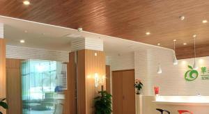 an office lobby with a wooden ceiling at Xian Song Of Apple Hot Spring Hotel in Xi'an +275 photos