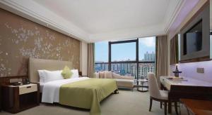 Ένα ή περισσότερα κρεβάτια σε δωμάτιο στο Yongzhou Chuang Fa Cheng XiaoXiangYi Hotel +253 φωτογραφίες