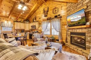 a living room with a fireplace in a log cabin at Along the Trail Cabin with Hot Tub Pool Pond Game Room in Wear Valley