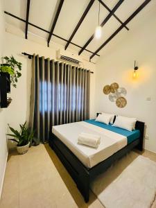 Postel nebo postele na pokoji v ubytování Little J villa