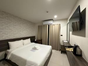 Ένα ή περισσότερα κρεβάτια σε δωμάτιο στο SEOUL3 HOTEL & SLOW BAR CAFE