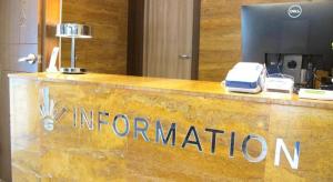 a reception desk with the information sign in a hotel at Seorak Mt., The East Sea and hot spring in P'i-gol