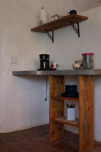 a counter in a room with wooden shelves at The O'asis in La Ribera