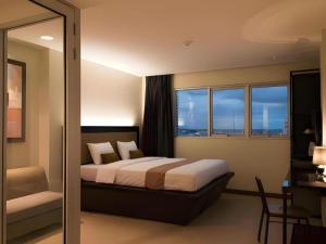 Postel nebo postele na pokoji v ubytování Gajahmada Avara Boutique Hotel + 223 fotografií