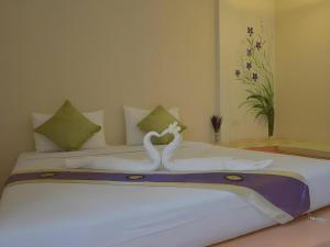 Postel nebo postele na pokoji v ubytování Mittraphap Resort