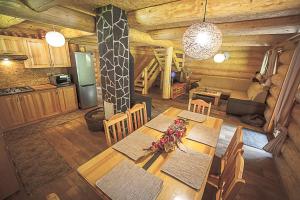 an overhead view of a kitchen and dining table in a cabin at Chata Lopušná dolina in Lučivná