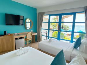 Postel nebo postele na pokoji v ubytování Kerala Coco Resort