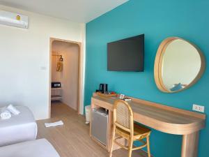 TV a/nebo společenská místnost v ubytování Kerala Coco Resort + 92 fotografií