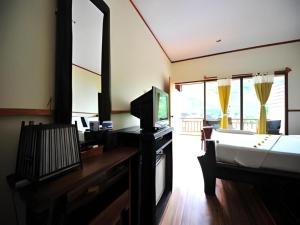 TV a/nebo společenská místnost v ubytování Phuttachot Resort