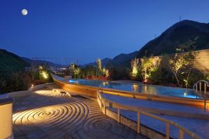 a bench with lights on it at night at Asaya in Nikko