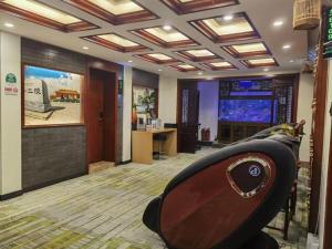 a room with a room with a bath tub in it at GreenTree Inn Beijing Dongcheng District Wangfujin South Luogu Lane Houhai Express Hotel in Beijing