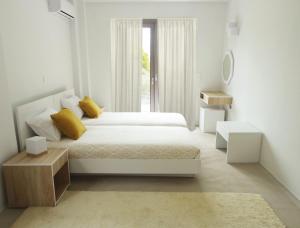 Кровать или кровати в номере Lepeda's Pearl