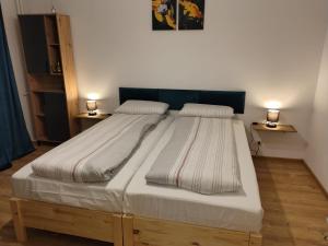 Postel nebo postele na pokoji v ubytování Green Studio Nord